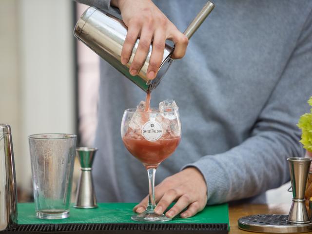 Pouring gin cocktail into Gin Festival glass